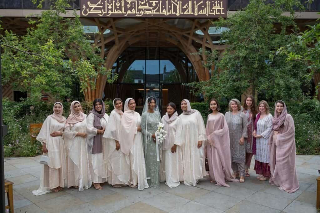 Group of women in traditional attire at cambridge mosque for nikah.