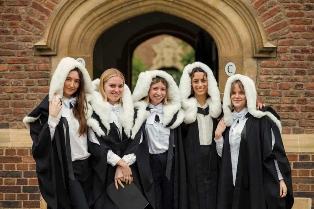 Cambridge Photographers 2 Five graduates together in gowns and white hoods
