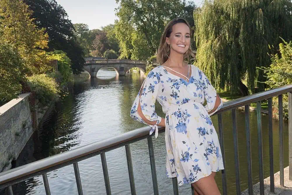 Gift Vouchers 2 Woman in a floral dress beside a cambridge riverside railing